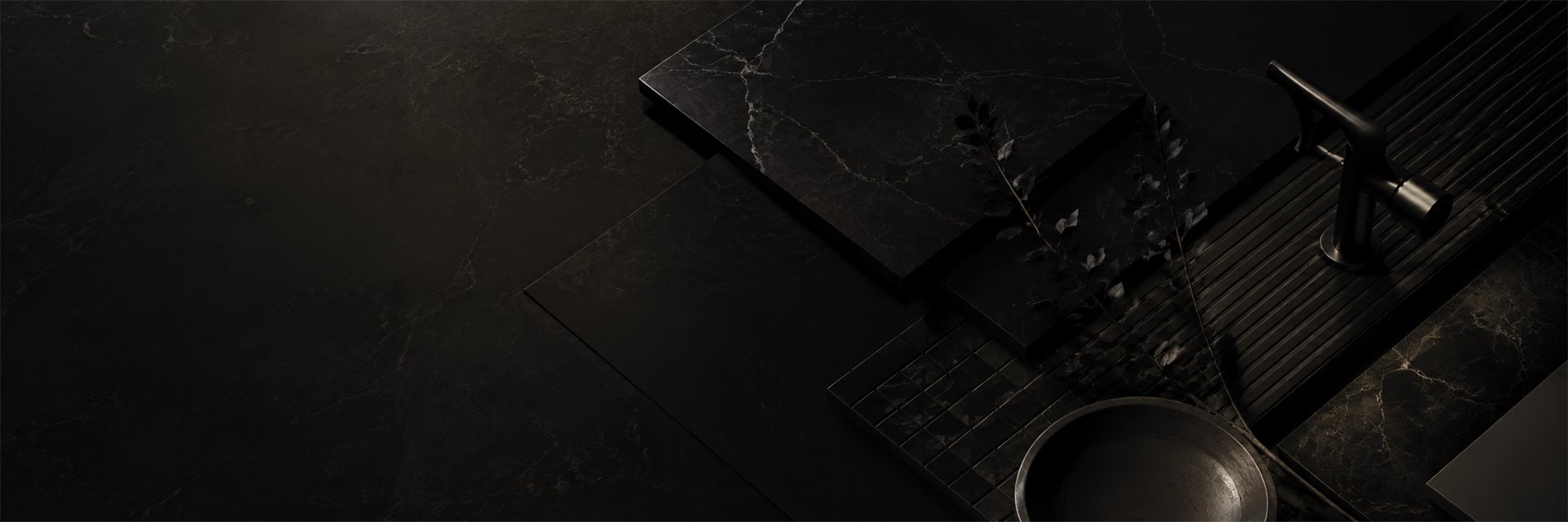 Black marble surfaces with a matte-black mixer and bowl
